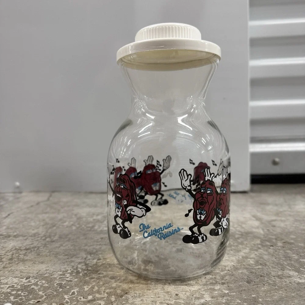 1989 Lot California Raisins Glass Carafe w Lid + 2 Christmas PVC Figures Vintage
